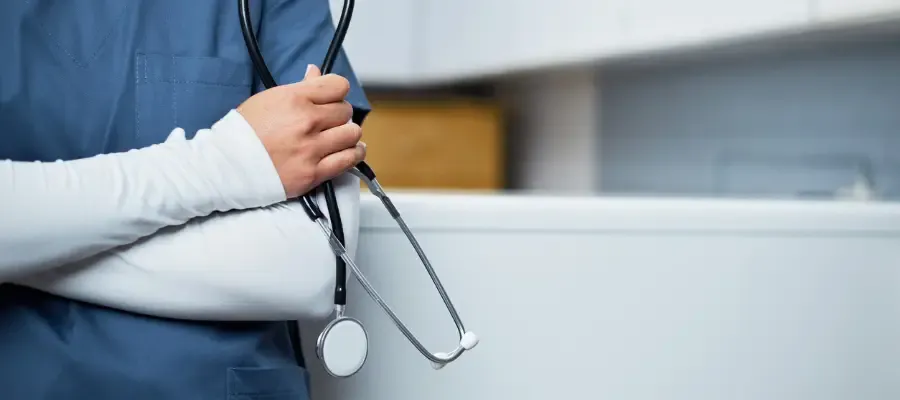 Nurse holding a stethoscope.