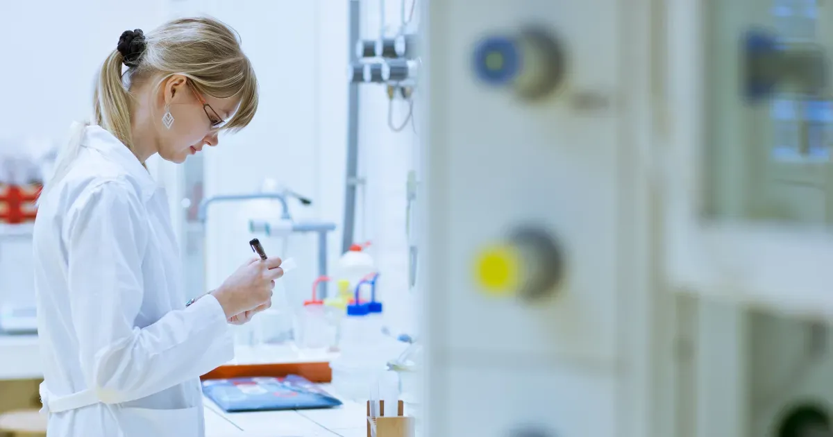 Doctor looking at lab test results in a clinic.