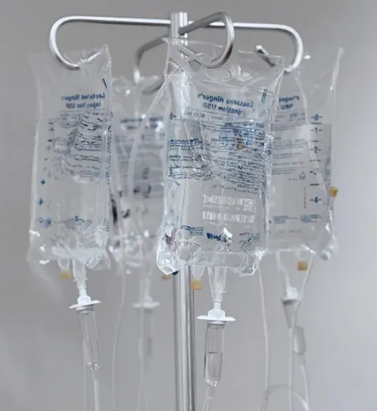 IV bags hanging on a hook.