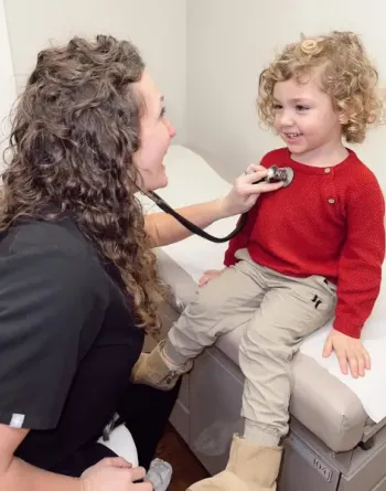 Meagan Qualls with a young patient.