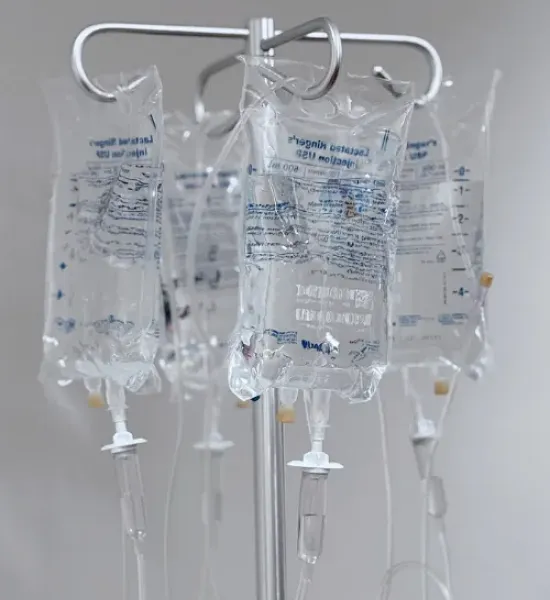 IV bags hanging on a hook.